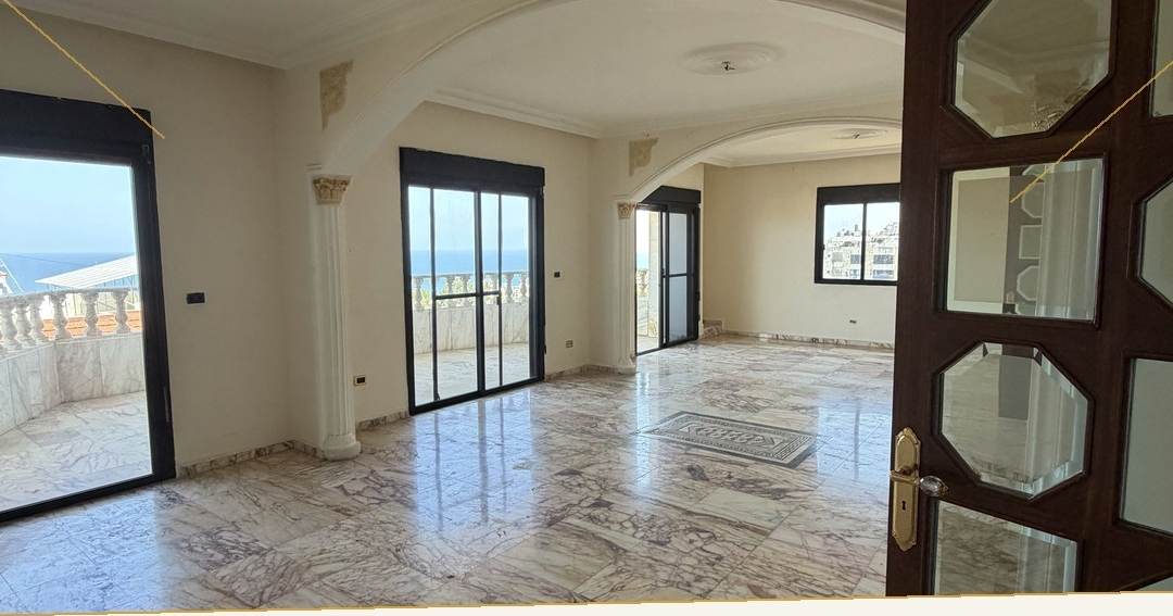Sea view living and dining room with marble floors, apartment for sale in Dohat El Hoss — Ref. 1187
