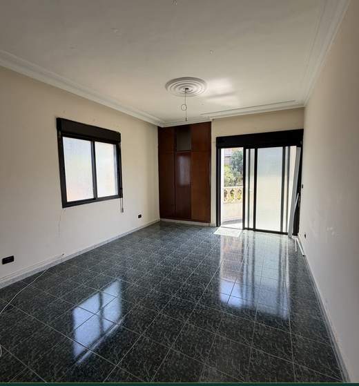 Bedroom with window and balcony door, apartment for sale in Dohat El Hoss — Ref. 1187