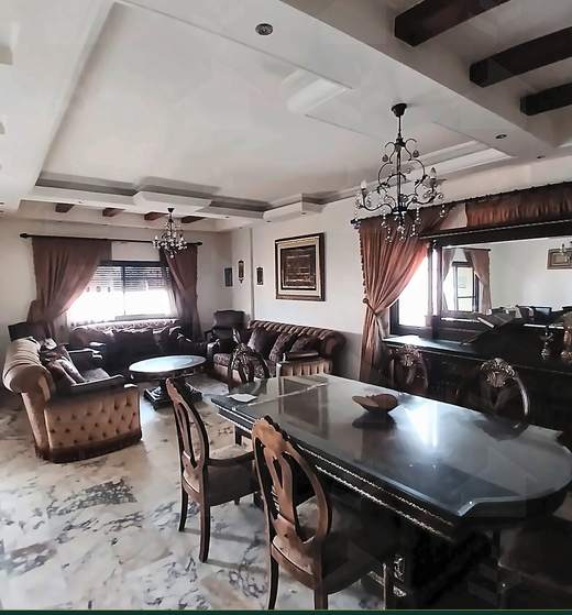 Reception opening onto the dining table, with exposed wood ceiling beams, apartment for sale on Tariq Al Matar, Haret Hreik — Ref. 1198