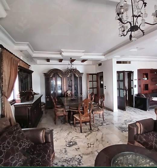 Wide view of the reception and dining room under a moulded ceiling, apartment for sale on Tariq Al Matar, Haret Hreik — Ref. 1198