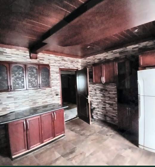 Kitchen with wood units, stone splashback and a wood-panelled ceiling, apartment for sale on Tariq Al Matar, Haret Hreik — Ref. 1198