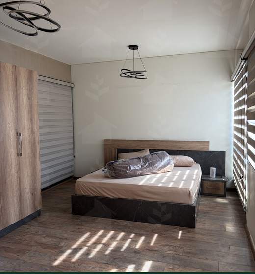 Double bedroom with fitted wardrobe and daylight through the blinds, apartment for sale in Zarif, Beirut — Ref. 1195