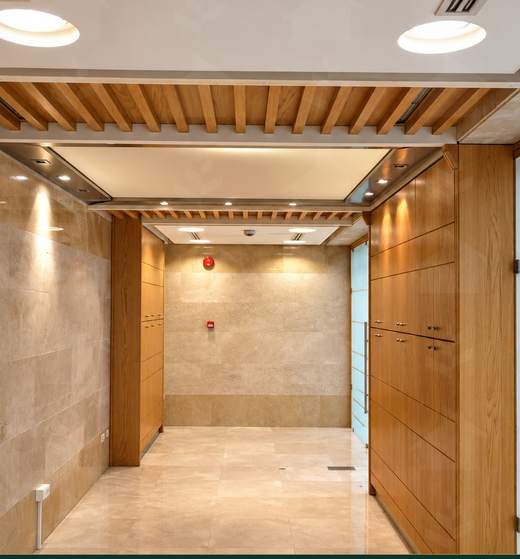 Wood-panelled reception corridor serving the office floor, Downtown Beirut — Ref. 1192