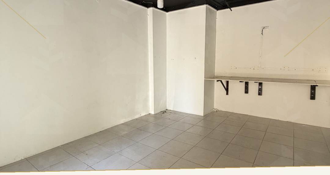 Tiled 20 m² commercial shop with wall brackets and pendant lighting, shop for rent in Mar Mikhael, Beirut — Ref. 1193
