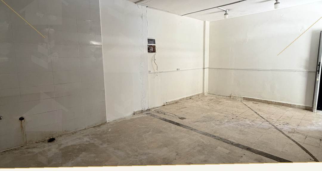 25 m² commercial unit in shell condition with bare floor and surface-run services, shop for rent in Mar Mikhael, Beirut — Ref. 1194
